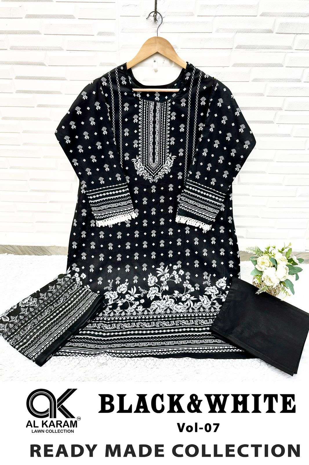 BLACK AND WHITE STICH SUITS READY WEAR BY AL KARAM-04